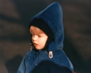 Boy watching Mummers Parade in Philadelphia in winter